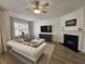 Cozy living room with fireplace, television, and abundant natural light at 4013 Conant Rd, Mount Pleasant, SC 29466