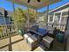 Inviting screened-in patio featuring comfortable seating and a dining table for outdoor relaxation at 4013 Conant Rd, Mount Pleasant, SC 29466