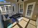 Inviting screened-in patio featuring comfortable seating and a dining table for outdoor relaxation at 4013 Conant Rd, Mount Pleasant, SC 29466