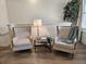 Cozy sitting area features hardwood flooring and two comfortable chairs at 4013 Conant Rd, Mount Pleasant, SC 29466