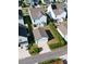 Aerial view of home showcasing fenced backyard, outdoor living spaces, garage, and neat landscaping at 403 Cool Bend Ln, Summerville, SC 29486