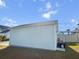A standalone garage sits alongside the home, with a small outdoor seating area and grill at 403 Cool Bend Ln, Summerville, SC 29486