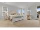 Bright main bedroom with an elegant bed frame, plush seating, and lots of natural light at 403 Cool Bend Ln, Summerville, SC 29486