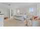 This well-lit bedroom showcases a decorative bed frame, plush seating, and ample space at 403 Cool Bend Ln, Summerville, SC 29486