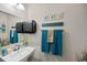 Bright half bathroom with nautical decor and modern fixtures, adding a touch of coastal charm at 409 Grand Palm Ln, Summerville, SC 29485