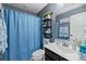 This bathroom features a shower curtain, shelving, decor, and fresh towels at 409 Grand Palm Ln, Summerville, SC 29485