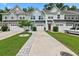 Charming townhomes with varied exterior colors, single car garages and well maintained landscaping at 409 Grand Palm Ln, Summerville, SC 29485