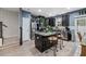 Modern kitchen with dark cabinets, stainless steel appliances, and a functional island at 409 Grand Palm Ln, Summerville, SC 29485