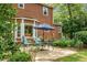 Backyard patio with outdoor seating, umbrella, and lush green lawn at 49 Crosscreek Dr, Charleston, SC 29412