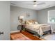 Bedroom with gray walls, ceiling fan, side table with lamp, and a red oriental rug at 49 Crosscreek Dr, Charleston, SC 29412