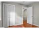 Bedroom with folding closet doors and doorway to the hallway and staircase at 49 Crosscreek Dr, Charleston, SC 29412