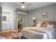 Bedroom with ensuite bathroom, mirrored closet doors, side table and lamp at 49 Crosscreek Dr, Charleston, SC 29412
