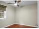 Bright bedroom features wood floors, ceiling fan, and a window with natural light at 49 Crosscreek Dr, Charleston, SC 29412