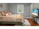 Bedroom with large window, television on a stand, and neutral colored bedding at 49 Crosscreek Dr, Charleston, SC 29412
