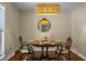 Dining room featuring a table set for four, updated lighting, and neutral walls at 49 Crosscreek Dr, Charleston, SC 29412