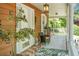 Inviting front porch featuring seating, decor, and a stylish front door of this charming home at 49 Crosscreek Dr, Charleston, SC 29412