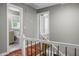 Upstairs hallway featuring wood floors and access to the bathroom at 49 Crosscreek Dr, Charleston, SC 29412