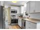 Modern kitchen with white cabinets and stainless steel appliances at 49 Crosscreek Dr, Charleston, SC 29412