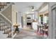 Open kitchen and dining area with tile floors, white cabinetry, and stainless steel appliances at 49 Crosscreek Dr, Charleston, SC 29412