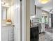 Open-concept view into kitchen from en suite bathroom, showcasing modern amenities at 49 Crosscreek Dr, Charleston, SC 29412