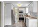 Bright kitchen featuring white cabinets and stainless steel appliances at 49 Crosscreek Dr, Charleston, SC 29412