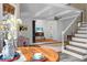 Bright living area with a wooden table, teacup, and staircase at 49 Crosscreek Dr, Charleston, SC 29412