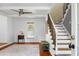 Bright living room with staircase, hardwood floors, and a ceiling fan at 49 Crosscreek Dr, Charleston, SC 29412