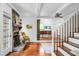 Inviting living room with stone fireplace, wood floors, and white-painted ceiling at 49 Crosscreek Dr, Charleston, SC 29412