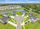 Aerial view of a pristine residential neighborhood surrounding a lush pond and cul-de-sac at 603 Cavour Ct, Summerville, SC 29486