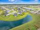 Expansive aerial view showcasing a residential neighborhood with ponds and green spaces at 603 Cavour Ct, Summerville, SC 29486