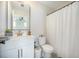 Well-lit bathroom with white vanity, brushed gold fixtures and decorative floor tile at 603 Cavour Ct, Summerville, SC 29486