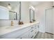 Bright bathroom with double vanity, stylish mirrors, black hardware and modern fixtures at 603 Cavour Ct, Summerville, SC 29486