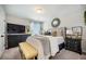 Cozy bedroom featuring an upholstered headboard, modern decor, and lots of natural light at 603 Cavour Ct, Summerville, SC 29486