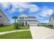 Charming two-story home with a well-manicured lawn and inviting curb appeal, complete with a two-car garage at 603 Cavour Ct, Summerville, SC 29486