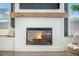 Fireplace with sleek design, complete with built-in window seats, and dark accent wall create a cozy focal point at 603 Cavour Ct, Summerville, SC 29486