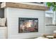 Detailed shot of the modern fireplace featuring a wooden mantle and shiplap accents, radiating warmth at 603 Cavour Ct, Summerville, SC 29486