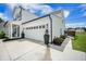 Home exterior featuring an attached two-car garage with modern carriage doors at 603 Cavour Ct, Summerville, SC 29486