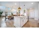 This spacious kitchen features a center island, stainless appliances, and flows into an open dining area at 603 Cavour Ct, Summerville, SC 29486