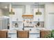 Modern kitchen with white cabinetry, light fixtures, a decorative backsplash, and stainless steel range at 603 Cavour Ct, Summerville, SC 29486
