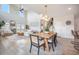 Sunlit living room with high ceilings, modern furnishings, and an open floor plan, perfect for entertaining and relaxing at 603 Cavour Ct, Summerville, SC 29486
