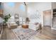 Sun-drenched living room with stylish decor, high ceilings, and a comfortable seating arrangement creating an inviting ambiance at 603 Cavour Ct, Summerville, SC 29486