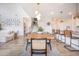 Open-concept living space with dining area, kitchen island with bar stools, seamlessly connecting living spaces at 603 Cavour Ct, Summerville, SC 29486