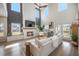 Inviting living room features high ceilings, a cozy fireplace, natural light, and a comfortable seating arrangement at 603 Cavour Ct, Summerville, SC 29486