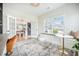 Well-lit home office with a built in bench and view into the hallway, custom shelves, and two large windows at 603 Cavour Ct, Summerville, SC 29486