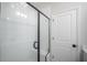 Modern shower features glass door, white subway tile and built-in bench at 603 Cavour Ct, Summerville, SC 29486