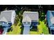 A bird's-eye view reveals a well-maintained home with a manicured lawn, nestled between neighboring properties at 619 Red Mulberry Rd, Moncks Corner, SC 29461