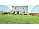 Spacious backyard with a well-maintained lawn and a fenced perimeter, perfect for outdoor enjoyment at 619 Red Mulberry Rd, Moncks Corner, SC 29461