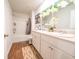Bright bathroom featuring a double sink vanity, modern lighting, and a shower-tub combination at 619 Red Mulberry Rd, Moncks Corner, SC 29461