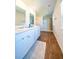 Bathroom featuring a double vanity, white cabinetry, and a walk-in shower at 619 Red Mulberry Rd, Moncks Corner, SC 29461