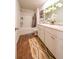 Well-lit bathroom features a double sink vanity, a shower-tub combo, and modern fixtures at 619 Red Mulberry Rd, Moncks Corner, SC 29461